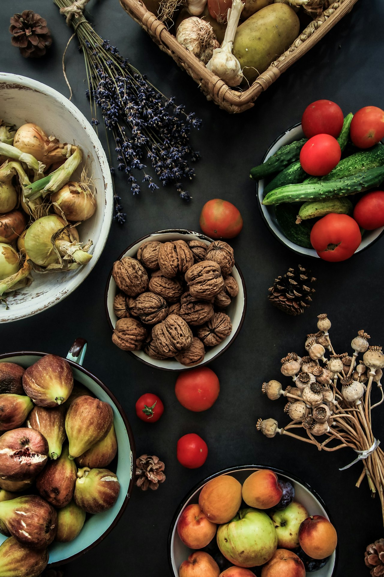 Fruit, vegetables and nuts laid out on a kitchen counter